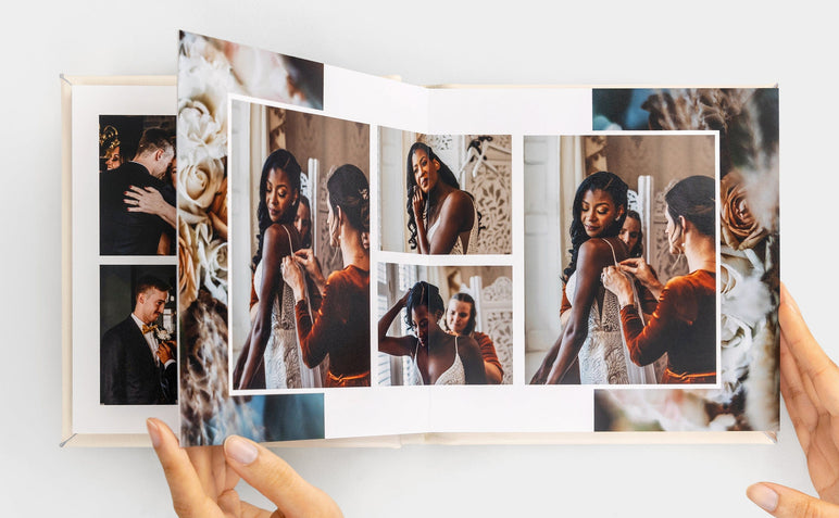 Overhead image of an open Album99 spread featuring photos of a woman getting ready for her wedding.