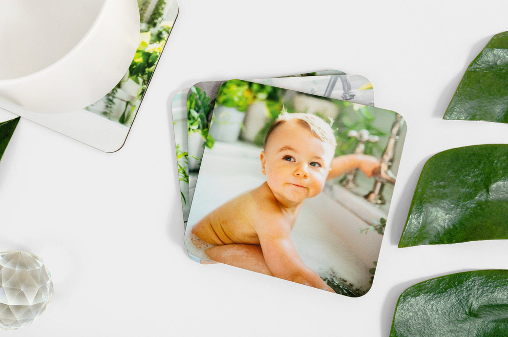 Set of Photo Coasters, the top coaster features a photo of a baby in a sink.