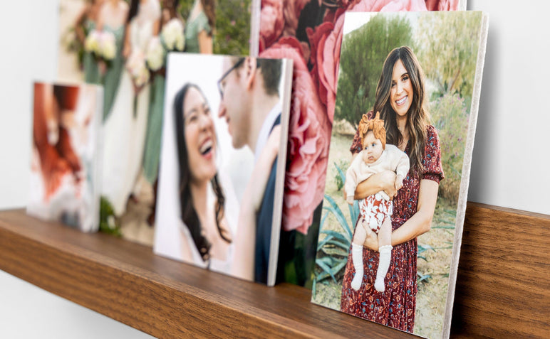 Five photo prints mounted on Foamcore styled on a photo ledge. The focus image is 4x6" and features a mother and her baby son.