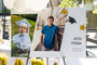 20x30" Photo Print mounted on Foamcore set up on an easel outdoors. Print features a Grad themed Collage Print with now and then photos of a graduating Senior.  