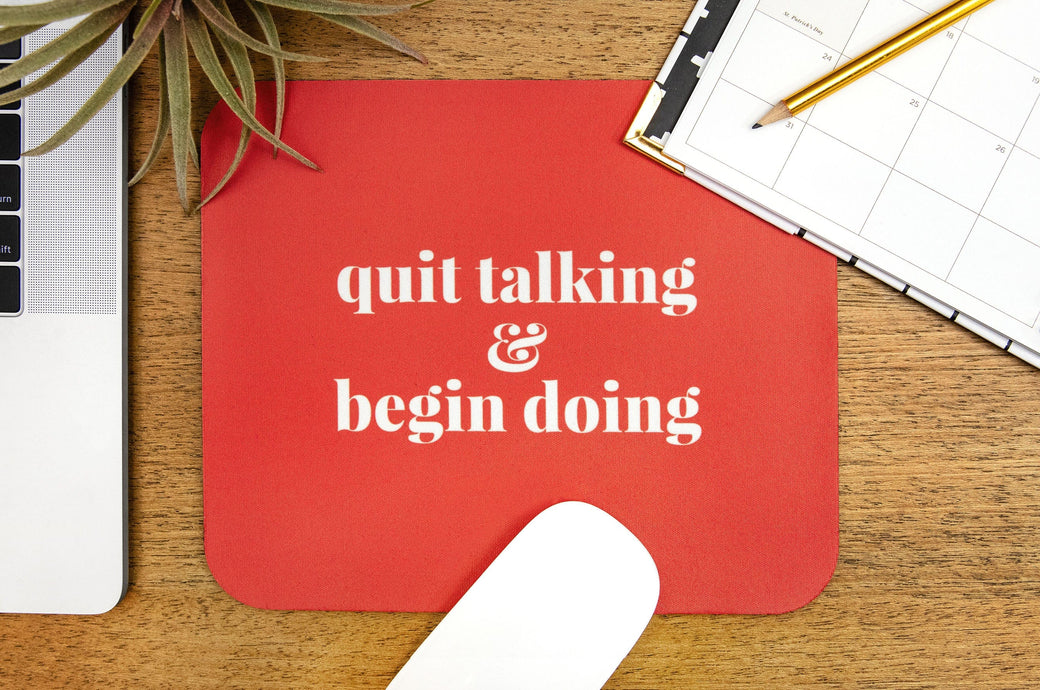 Mouse Pad featuring a motivational phrase in white text on a red background. 