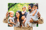 Woman holding 16x20" Photo Print featuring a family with three young children. 