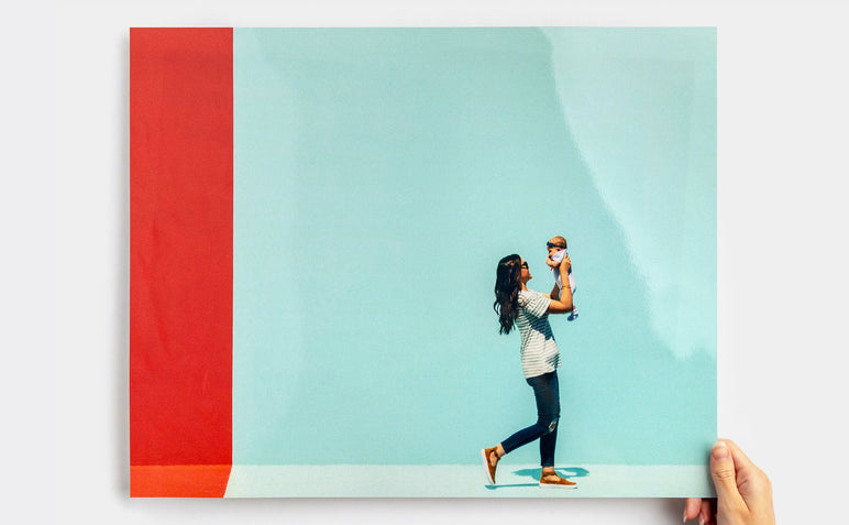Large Pearl Photo Print featuring a picture of a woman and child in front of a blue wall.