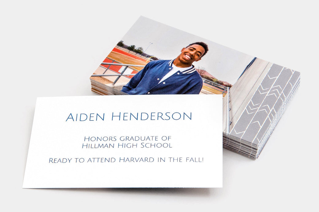 Stack of 2x3.5" Senior Rep Cards, featuring a photo of a happy, teen boy on one side of the card and information about his graduation on the other.