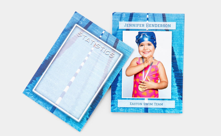 One Trader Card featuring a picture of a young swimmer. 