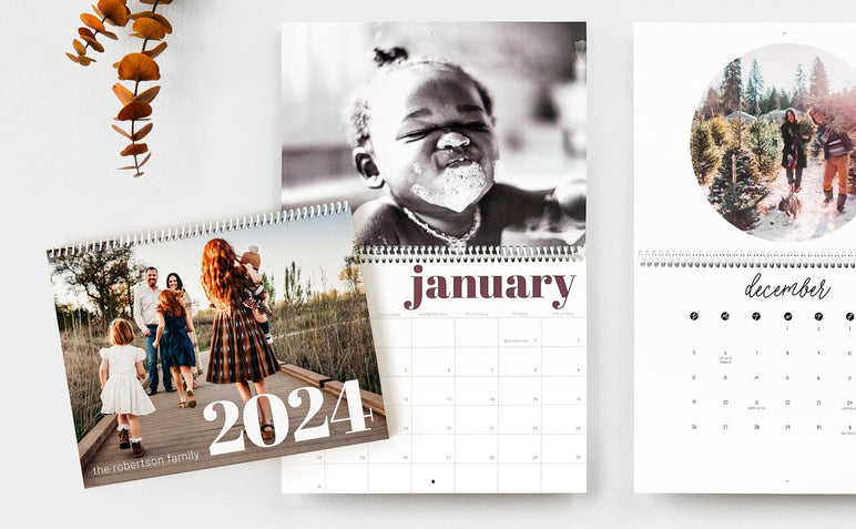 Flat lay of three 8.5x11" Wall Calendars, two Wall Calendars are open to show dates and the third Wall calendar is closed to show the cover design. 