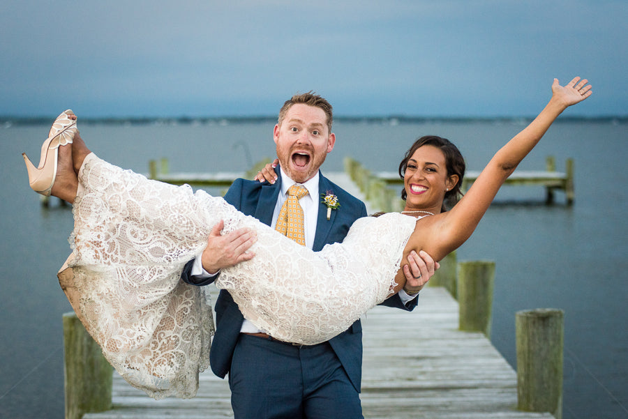 Groom carrying bride