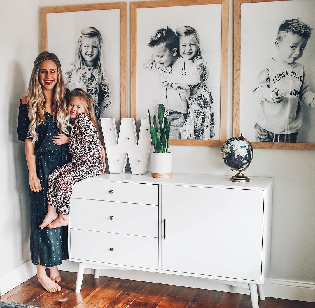 kids in front of framed photos
