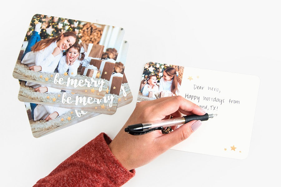 Writing holiday card to armed force member