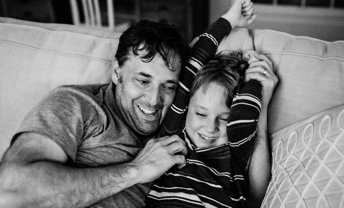 Dad and his son on the couch