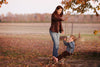 Family photograph in field by Jennifer Warthan Photography