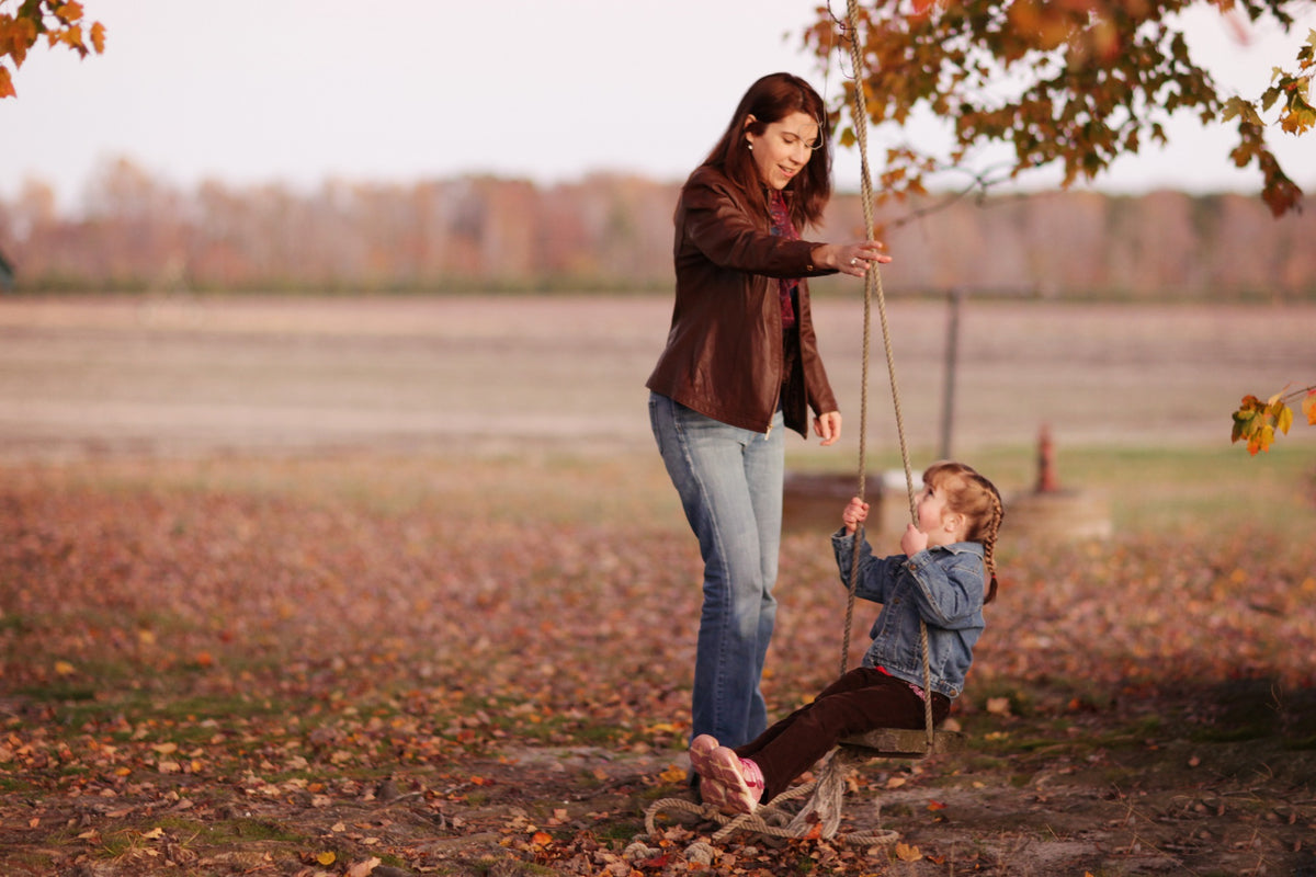 Family photograph in field by Jennifer Warthan Photography