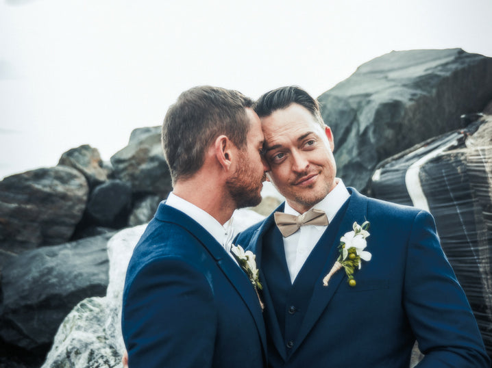 Two men pose on their wedding day