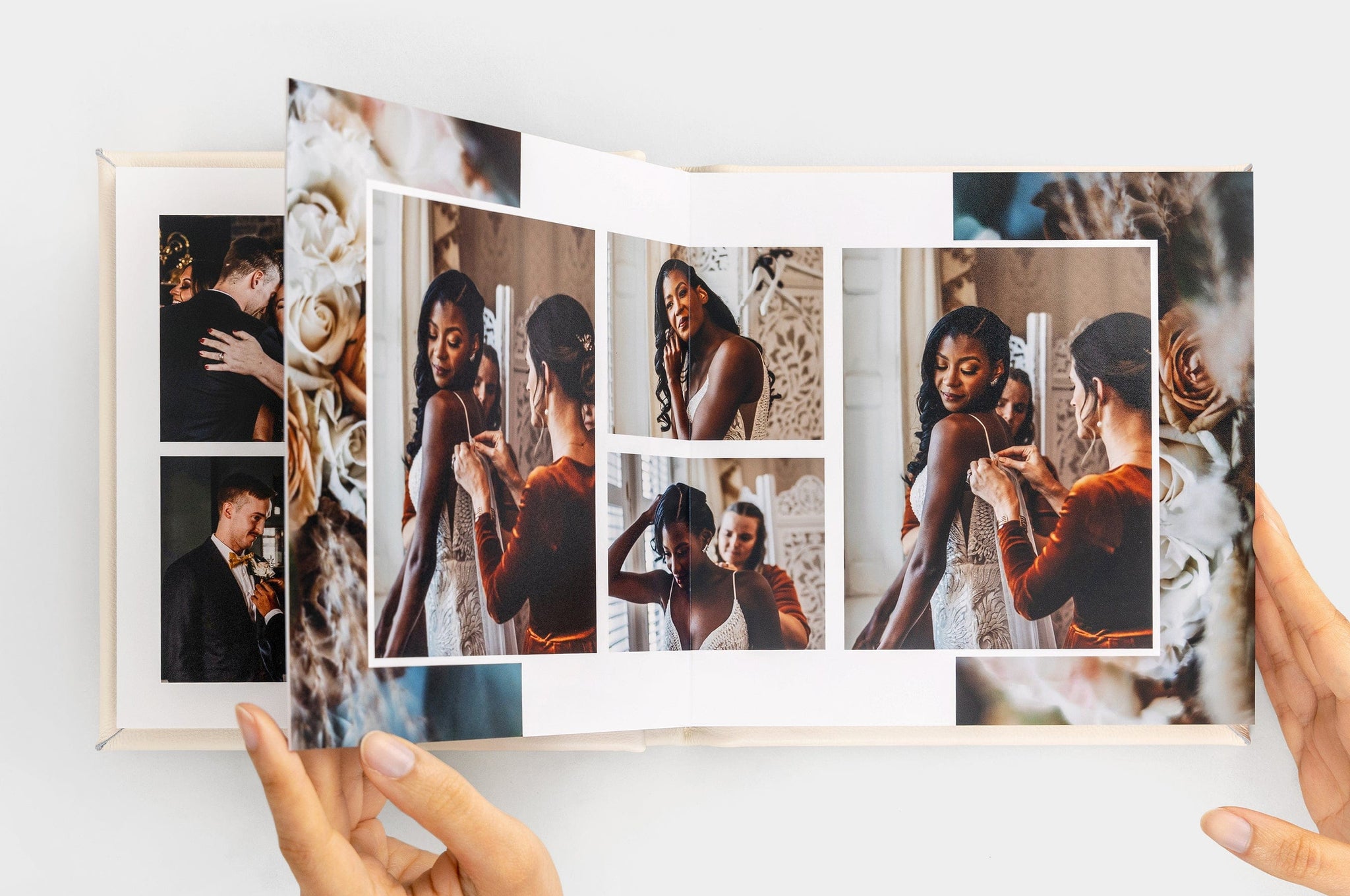 Overhead image of an open Album99 spread featuring photos of a woman getting ready for her wedding.