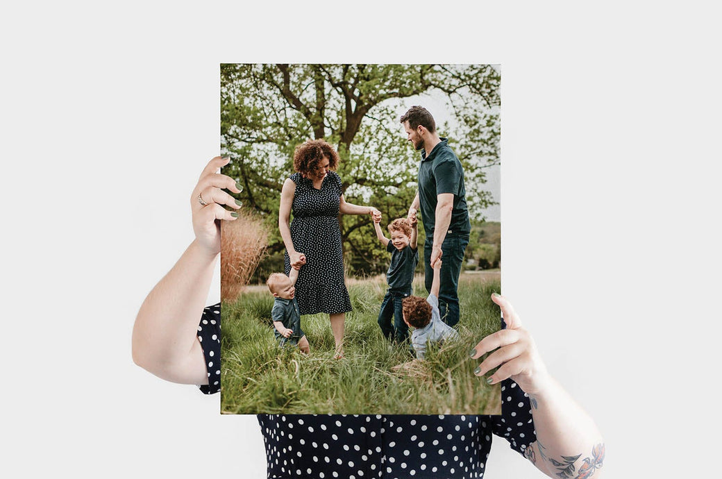16x20" Landscape Canvas Print featuring a photo of a family with three young children