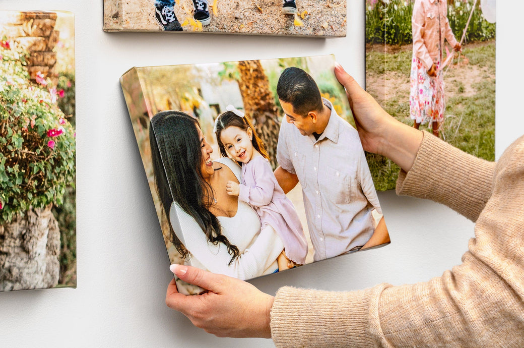 Close up shot of a Classic Canvas Print featuring a man and women with their daughter.