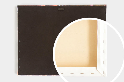Image of the finished back of our Classic Canvas Print featuring a sawtooth hanger. There is a cut away to show that the Canvas is stretched around a hollow wood frame.