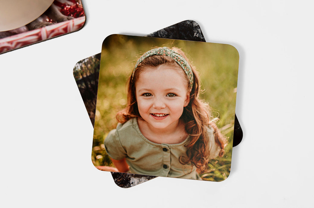Set of Photo Coasters, the top coaster features a photo of a young girl. 