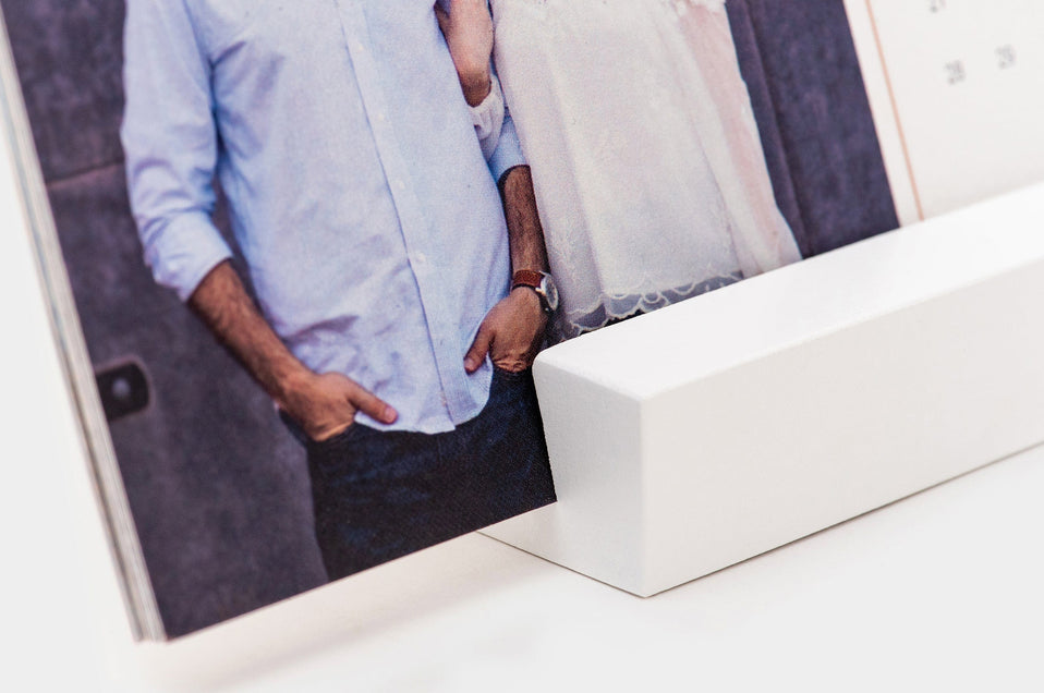 Detail shot of the white block used to stand Desk Calendars up.