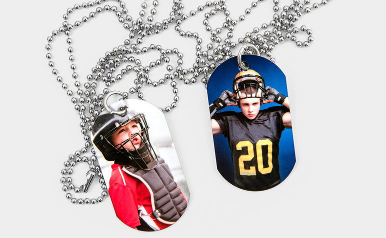 Two Dog Tags featuring pictures of young athletes. 