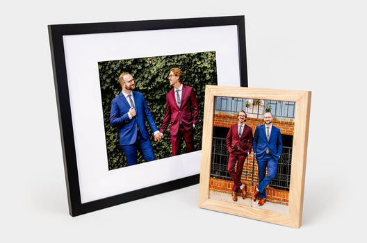 Two Framed Prints, one 16x20" and the other 8x10" shot at an angle on white banckground. 