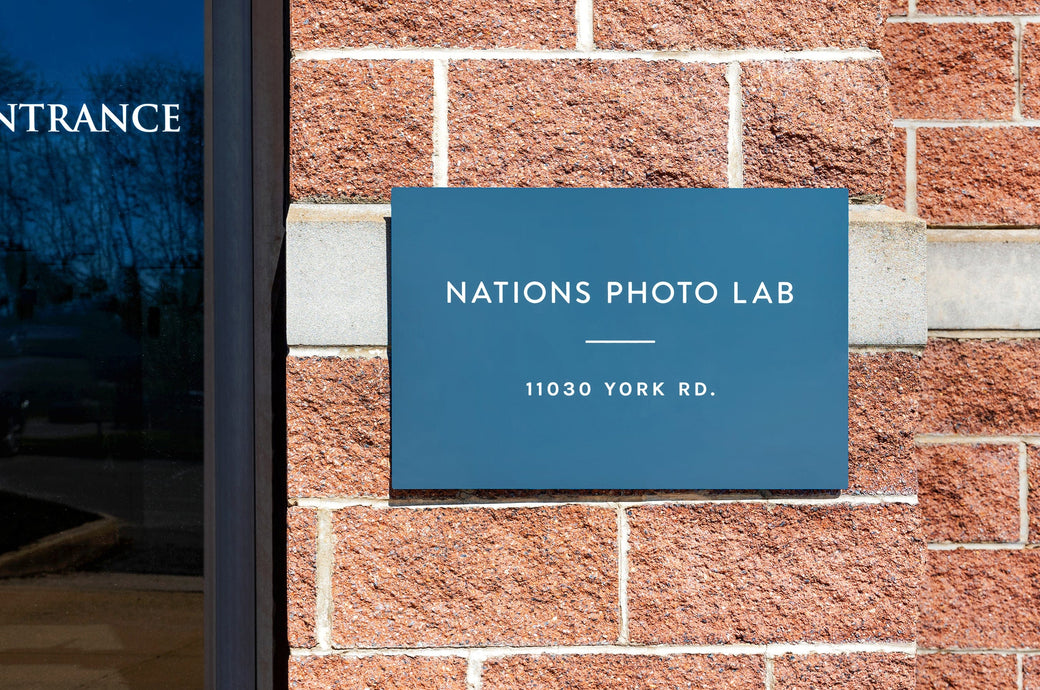 16x20" Metal Print being used as a sign on the outside of an office building.