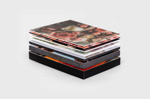 Close-up Corner detail of two photo prints stacked on top of each over. The top print is mounted on 3/16"  gatorboard and  the  bottom print is mounted  on 1 /2"  gatorboard - Nations Photo Lab