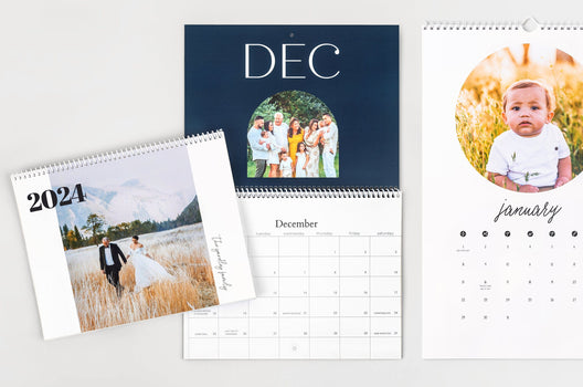 Flat lay of three 8.5x11" Wall Calendars, two Wall Calendars are open to show dates and the third Wall calendar is closed to show the cover design
 - Nations Photo Lab