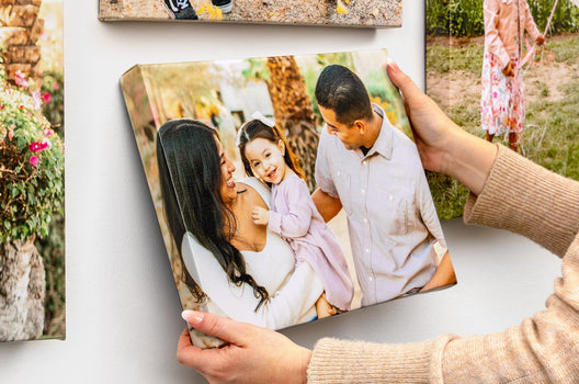 Close up shot of a Classic Canvas Print featuring a man and women with their daughter.