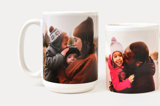 A 15oz Photo Mug and an 11oz Photo mug featuring wintery images of parents with their children - Nations Photo Lab