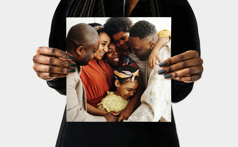 Flat lay of a 10x10" Professional Photo Prints featuring a picture of a family