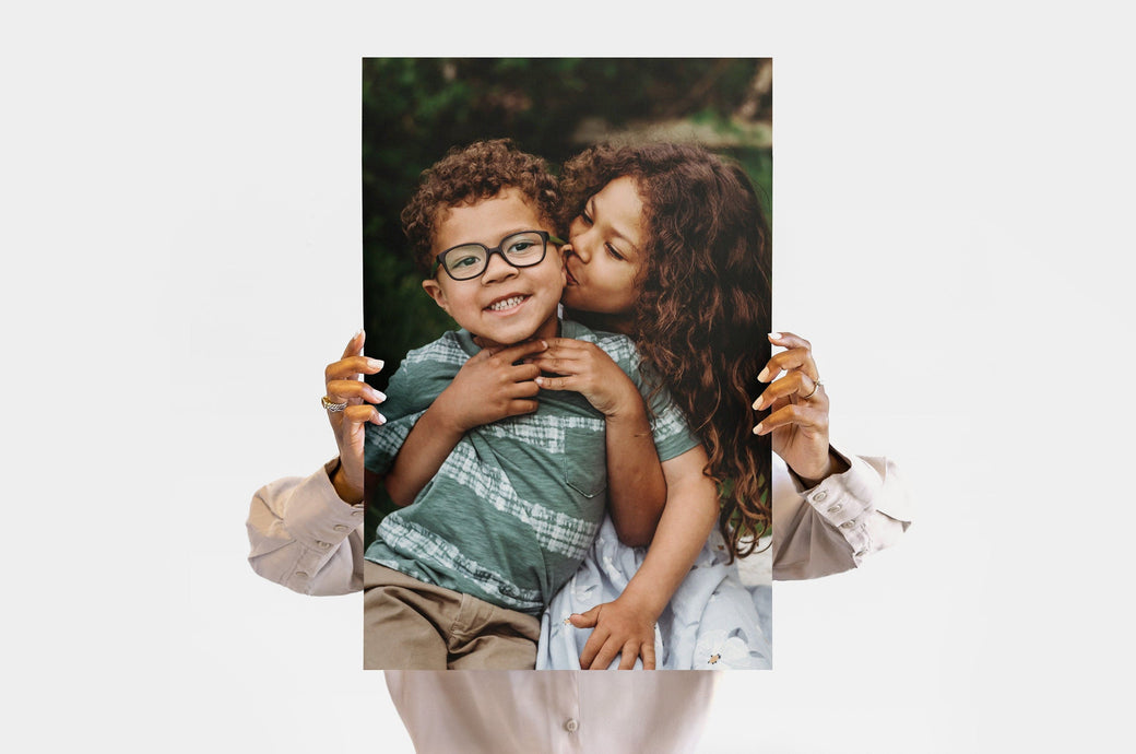 Woman holding a 16x24" Photo Print featuring a picture of two children.  