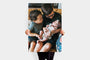 Woman holding a 30x45" Photo Print featuring a picture of two kids holding a baby.