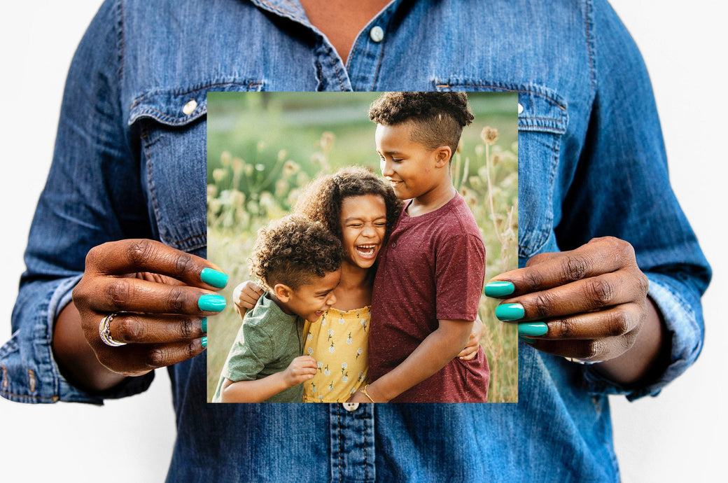 Flat lay of a 8x8" Professional Photo Prints featuring a picture of three children