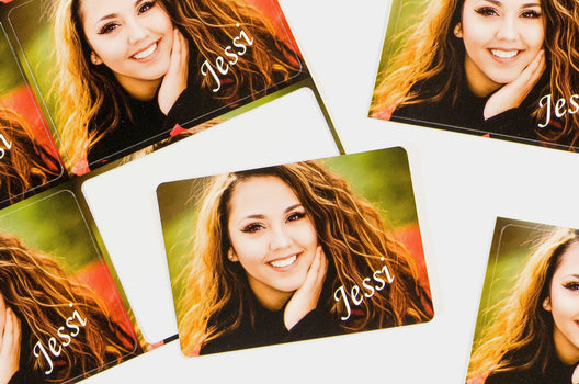 Picture of 8 Die Cut Signature Wallets with a photo of a teen girl on them and the script text "Jessi" in the bottom right corner - Nations Photo Lab