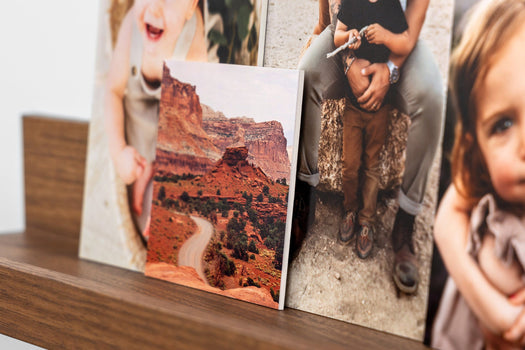 Four photo prints mounted on Double Weight Matboard styled on a photo ledge. The focus image is 4x4