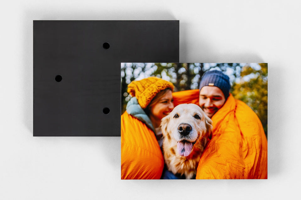 Lay flat image of the front and back of a Standout Mounted Print, which come with four holes on the back, making Standouts ready to hang out of the box.