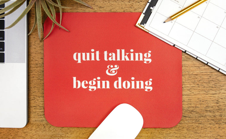 Mouse Pad featuring a motivational phrase in white text on a red background. 