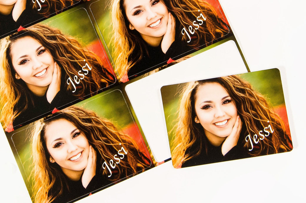 Picture of 8 Die Cut Signature Wallets with a photo of a teen girl on them and the script text "Jessi" in the bottom right corner.