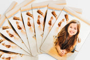 Stack of 8 Die Cut Wallet Photo Prints with a picture of a young girl on them - Nations Photo Lab