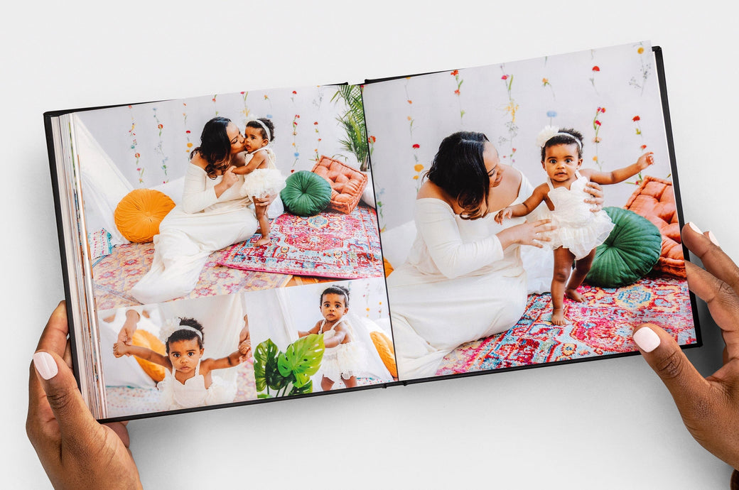 Overhead shot of a 8x8" Lay Flat Photo Books feauturing photos of a toddler and her mother. 