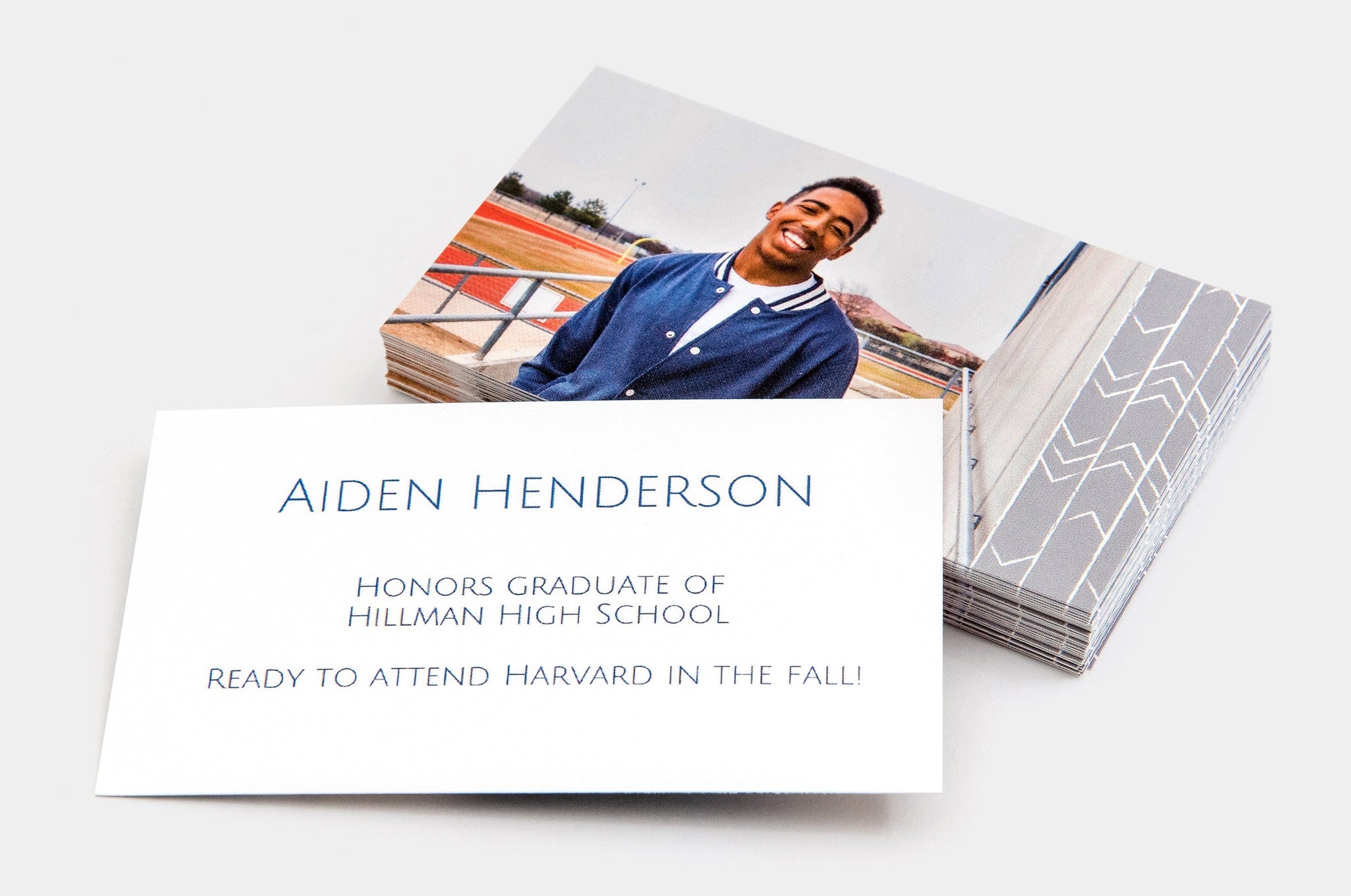 Stack of 2x3.5" Senior Rep Cards, featuring a photo of a happy, teen boy on one side of the card and information about his graduation on the other.