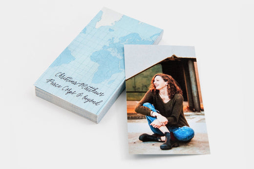 Stack of 2x3.5" Senior Rep Cards, featuring a photo of a happy, teen girl on one side of the card and information about her graduation on the other.