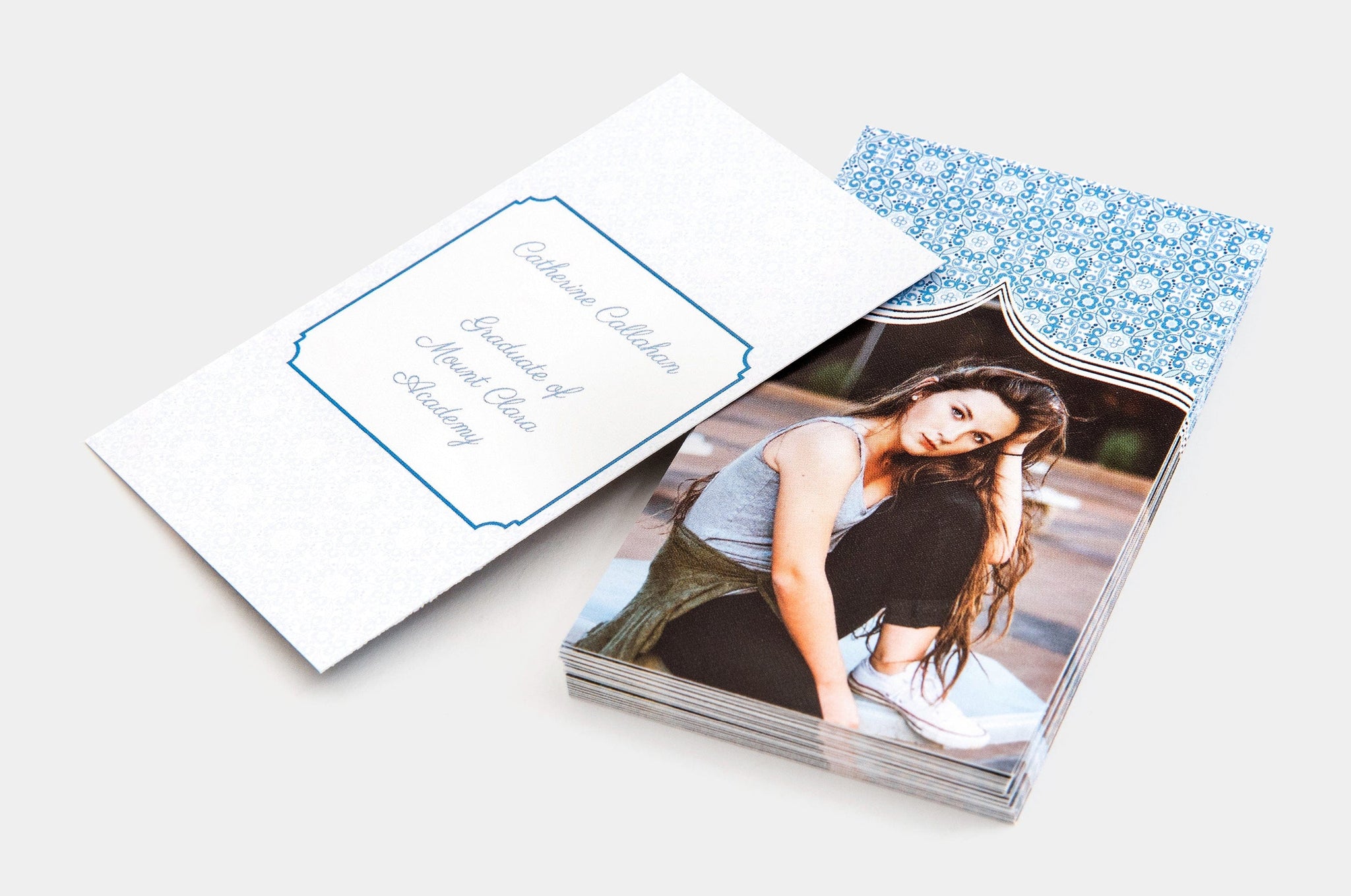 Stack of 2x3.5" Senior Rep Cards, featuring a photo of a teen on one side of the card and information about her graduation on the other.