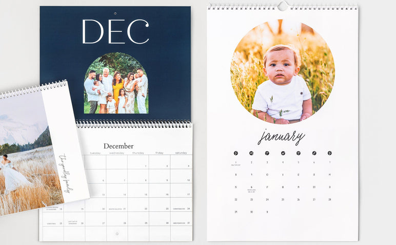 Flat lay of two 8.5x11" Wall Calendars, one open and one closed, as well as an open 11x17" Wall Calendar.