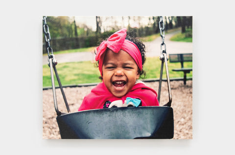 The Ultimate Guide to Styling Canvas Wall Art Decor. Your home is your canvas, and with the right wall art decor, you can make it into a masterpiece. holding up a christmasy 24x36" Premium Canvas to hang on a wall - Nations Photo Lab