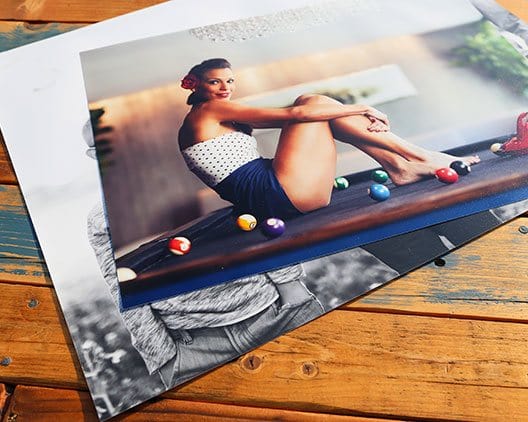 Girl posing for a picture on top of a pool table on a 30x40 custom photo print